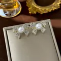 Elegant gold-tone pearl bow stud earrings with sparkling rhinestones for women. - 61# Full Diamond 3d Bow Pearl Earrings