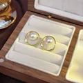 French vintage gold irregular oval stud earrings with elegant white pearl detail - 67# Hollowed-out Twisted Geometric Pearl Stud Earrings