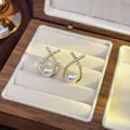 Elegant gold plated X-shape stud earrings featuring white pearls and tiny crystals - 72# Micro-painted X-shaped Pearl Stud Earrings