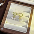 Elegant gold hoop earrings featuring double white pearl dangles in a French retro style - 74# Tassel Pearl Earrings