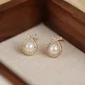 Elegant pearl stud earrings with a cubic zirconia bow design in a polished golden finish - 76# Full Diamond Fish-shaped Pearl Earrings