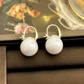 Elegant French retro pearl dangle earrings featuring rainbow sheen and gold hooks - 86# Geometric Pearl Earrings