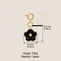 Elegant black flower charm pendant in gold-plated copper, measurements 12.4mm x 9.8mm - October Flower Pendant