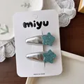 Silver leather snap hair clips for girls with sparkling blue glitter star decoration - Star Sequin BB Hair Clips