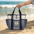 Navy blue mesh beach bag with large capacity for travel and swimming held on beach - Navy Blue