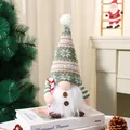 Festive luminous Christmas gnome plush with green snowflake knit hat and candy cane - Light-up Plush Toy With A Cane