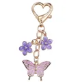 Elegant gold-tone metal butterfly and purple flower keychain with heart clasp - Purple Butterfly