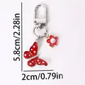 Red butterfly and flower keychain with metal lobster clasp and elegant pearl detail - Red Dotted Butterfly