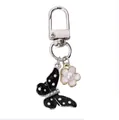Cute black polka dot butterfly keychain with white flower charm and silver lobster clasp - Black Polka Dot Butterfly