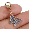 Elegant gold butterfly charm featuring blue rhinestones and a durable lobster clasp - Blue Diamond Butterfly