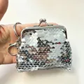 Macro view of a silver sequined mini coin purse with a secure metal kiss-lock clasp - With Keychain / 8cm x 7cm / Silver