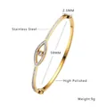 Elegant gold stainless steel evil eye bangle with pavé crystals and product dimensions - Gold