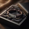 Close-up of a punk style brown leather bracelet with a metal cross in a gift box. - Adjustable Cross Braided Leather Style