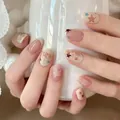 Short oval press-on nails featuring a nude pink gradient and star patterns, 30 pieces. - BS2302 / Full Sizes (M/S/XS)#30 Pieces/Plate