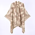 Detail view of the beige and brown camellia floral pattern on soft knit winter poncho - New Short-bearded Camellia Khaki / 130x150cm
