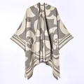 Detailed view of the fabric texture and camellia floral pattern on this warm poncho shawl - New Short-bearded Camellia Gray / 130x150cm