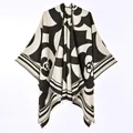 Detail of reversible faux cashmere poncho shawl with black and beige camellia pattern - New Short-bearded Camellia Black Rice / 130x150cm