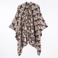 Close-up of brown geometric pattern faux cashmere poncho with fringe detail - Short Brown Shawl With Letter T Styling / 130x150cm
