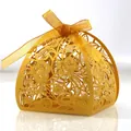 Elegant golden laser-cut wedding candy box with floral patterns and matching ribbon bow - Gold