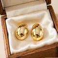 Chunky 18K gold plated oval stud earrings presented in a vintage wooden jewelry box - Smooth Oval Minimalist (E0873)