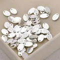 Detailed macro view of silver oval metal tags engraved with 'Hand Made' for DIY jewelry - 65# Thick Silver Large Oval Shape [1 Piece] A1-503 (approx. 11*7.2mm)