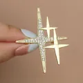 Sparkling gold starburst brooch with rhinestones for elegant suit and clothing decor - Gold Four-pointed Star