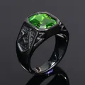 Close-up detail of men's black Freemason ring with a large green emerald-cut stone. - Black with Olive Green Stone