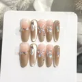 Uñas postizas ojo de gato con mariposas, degradado nude champán y adornos de perlas glam. - Grande (Óvalo Largo)