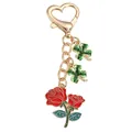 Elegant gold-tone metal keychain featuring red roses and green four-leaf clover charms - Rose String