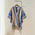Detailed view of an ethnic knit poncho with blue geometric patterns and fringe - Khaki Blue / 170x110cm (large Size)