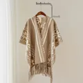 Detailed view of ethnic patterned poncho shawl with tassels in beige and white colors. - Khaki / 170x110cm (large Size)