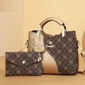 Macro detail of fashionable monogram printed tote bag and matching pouch set in brown. - With Small Pouch / Gold