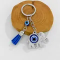 Detailed view of silver elephant evil eye keychain with vibrant blue tassel accessory - Silver Elephant Blue Tassel Motif (8424)