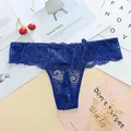 Detailed macro view of sexy royal blue floral lace thong for women with sheer mesh details. - One Size / Sapphire Blue