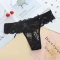 Elegant black floral lace thong for women featuring delicate bow details on the waist. - One Size / Black