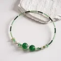 Macro view of retro green marbled beads and silver accents on a beaded choker - Choker Clavicle Chain (HN13032) / Green