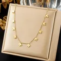 Detailed view of a gold-plated stainless steel necklace with delicate swallow charms - Minimalist Gold Swallow Silhouette Choker (N4502)