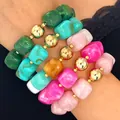 Detailed view of colorful acrylic barrel bead bracelets with glossy golden accents. - 5-Piece Bracelet Set / Mixed Colors