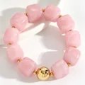 Close-up of pink acrylic square bead bracelet with a large gold accent ball detail - Pink Crystal (11254)