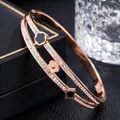 Detailed view of rose gold titanium steel bracelet with clover motifs and crystal inlay. - Clover Rhinestone Style (41-A-10) / Rose Gold