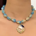 Close-up of sea salt style blue white marbled resin bead necklace with shell pendant. - Necklace Only (12051) / Gold