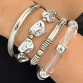 Detailed view of a silver minimalist four-piece bracelet set with irregular textures - Cold Style Silver Irregular Texture Bangle 4-Piece Set (1141)