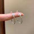 Detailed view of silver-tone hoop earrings featuring white black polka dot beads - 4cm (83#) / Silver (Polka Dot Decoration)