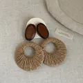 Bohemian holiday style earrings featuring dark wood studs and large woven straw hoop pendants. - Oval Pendant Style (6#) / Brown
