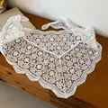 Macro view of delicate white hollowed-out crochet lace pattern on triangular scarf - Large Flower Pattern / White