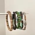 Vista dettagliata di vari braccialetti bohémien in legno e perline turchesi su un'asta - 1# Bracciale / Set da 6 / Verde E Caffè