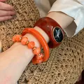 Set di bracciale rigido in resina e bracciale di perline nei toni arancio e marrone da donna - Stile 53 / Set di 3 pezzi / Arancione