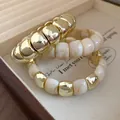 Elegant vintage gold stacked bracelet set featuring cream marble beads for women - Three-Piece Set / 28# Bangle Cream
