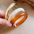 Retro 3-piece stacked bangle set featuring gold metallic, cream white, and amber resin finishes. - Three-Piece Set / 51# Bangle Gold Brown Ivory