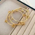 Vintage-style gold plated stackable bangles featuring textured bands and bead clusters - Three-Piece Set / 54# Bangle Gold
